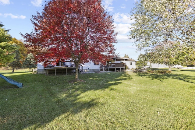 view of yard with a wooden deck