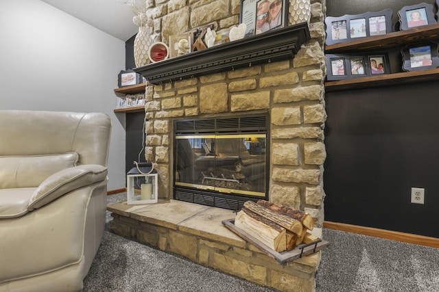 interior space with carpet flooring and a stone fireplace