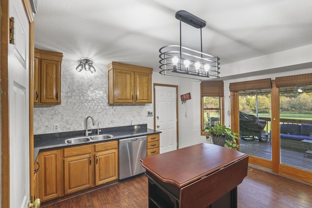 kitchen with backsplash, stainless steel dishwasher, dark wood-type flooring, sink, and decorative light fixtures