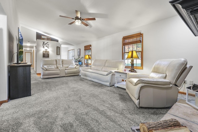 living room featuring carpet flooring, ceiling fan, and lofted ceiling