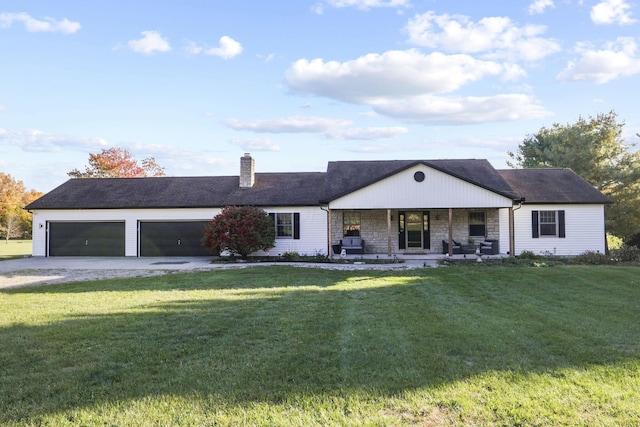 ranch-style home featuring a porch, a garage, and a front lawn