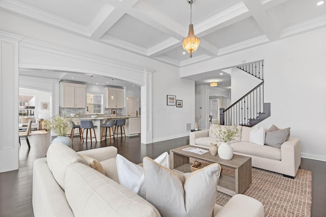 living room featuring coffered ceiling, beam ceiling, and dark hardwood / wood-style flooring