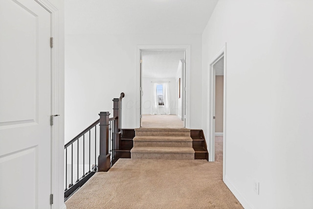 corridor with carpet floors