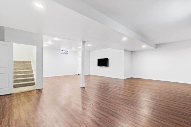 unfurnished living room with dark hardwood / wood-style floors