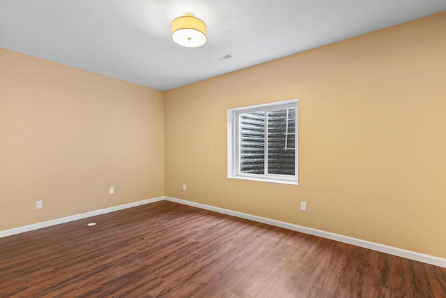 empty room featuring hardwood / wood-style flooring