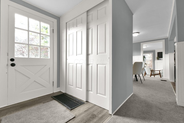 entryway featuring carpet floors