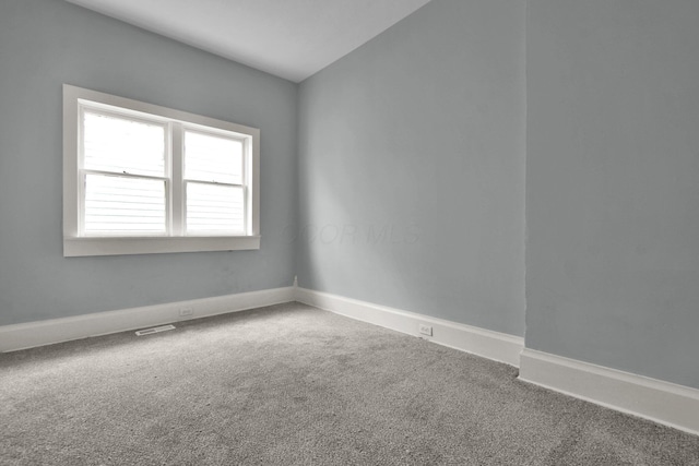 unfurnished room featuring carpet flooring