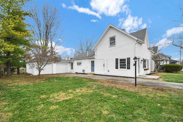 rear view of house with a lawn