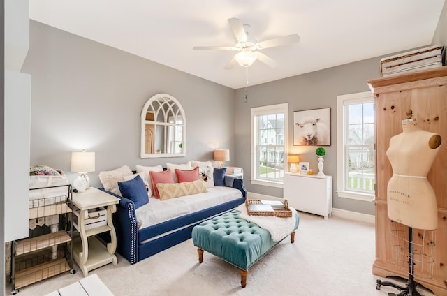 living room with ceiling fan and carpet floors