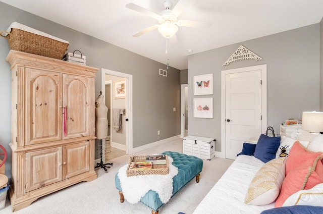 bedroom with light carpet and ceiling fan