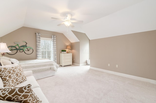 bedroom with light colored carpet, ceiling fan, and lofted ceiling