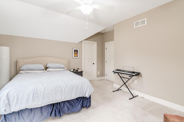 carpeted bedroom featuring ceiling fan and lofted ceiling