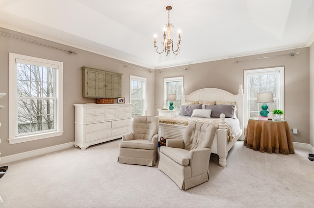 carpeted bedroom with a tray ceiling, an inviting chandelier, and crown molding