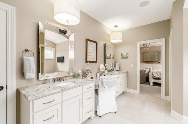 bathroom featuring tile patterned flooring and vanity