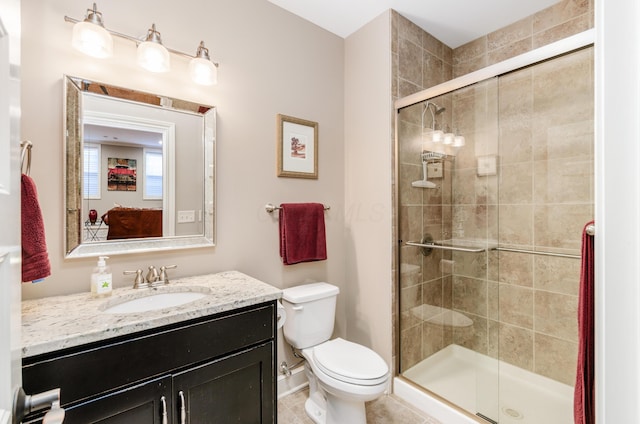 bathroom with vanity, toilet, and walk in shower