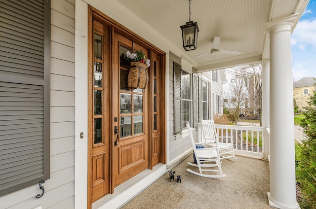 property entrance with ceiling fan and a porch