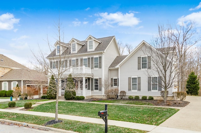 view of front of home featuring a front lawn and a porch