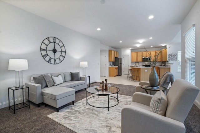 living room with carpet and vaulted ceiling