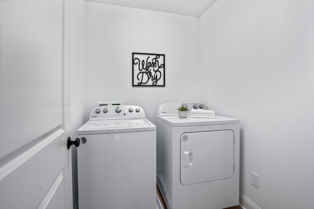 laundry area with separate washer and dryer