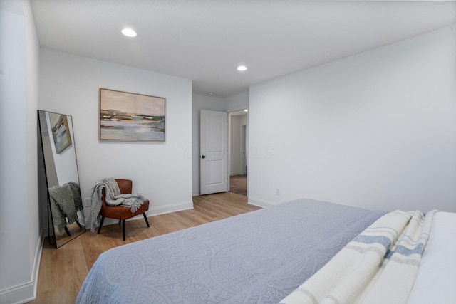 bedroom with light hardwood / wood-style floors