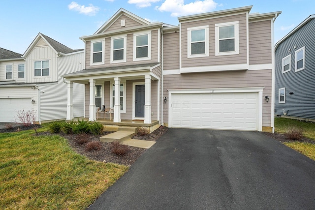 view of front of property featuring a porch and a garage