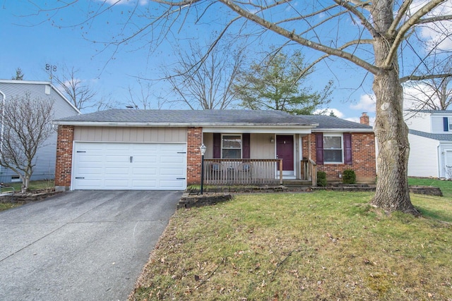 ranch-style home with a front yard, a garage, and covered porch