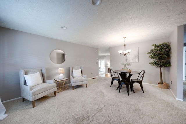 carpeted dining area with a textured ceiling and an inviting chandelier