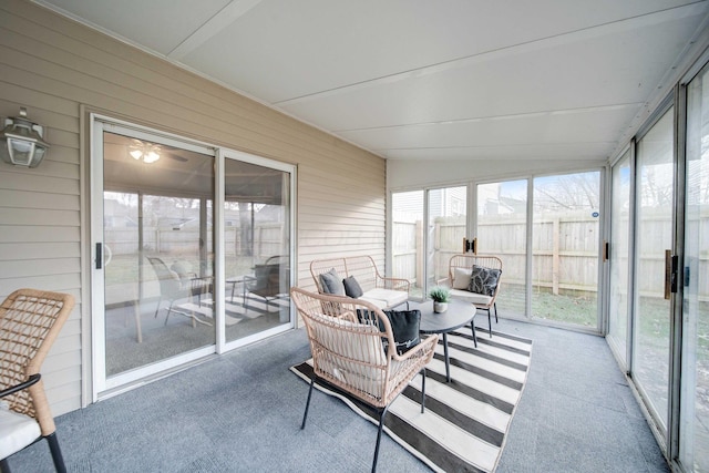 sunroom featuring lofted ceiling