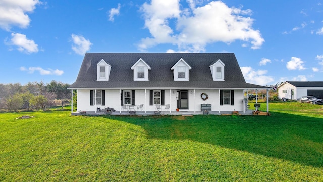 new england style home with a porch and a front yard