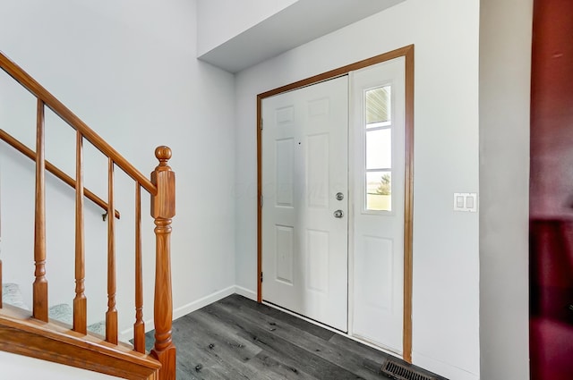 foyer featuring dark wood-type flooring