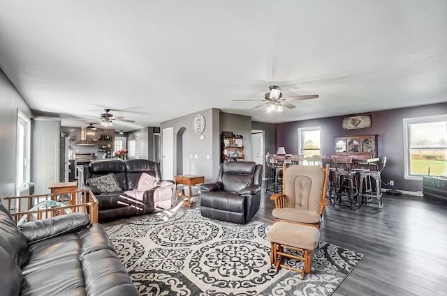 living room featuring hardwood / wood-style flooring, ceiling fan, and a healthy amount of sunlight