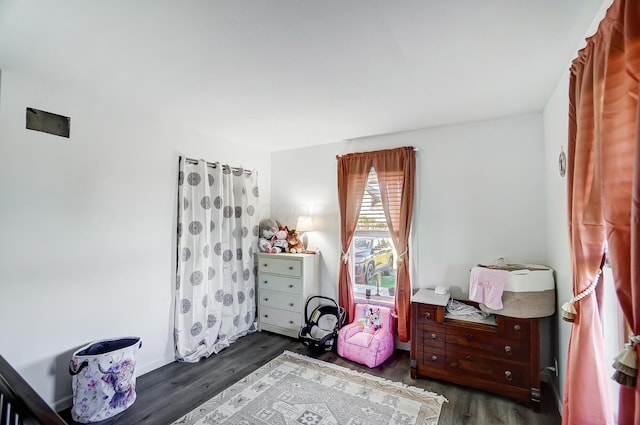 bedroom featuring dark wood-type flooring