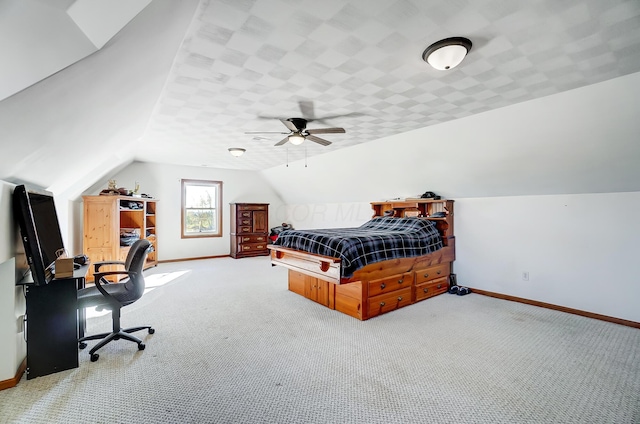 bedroom with light colored carpet, vaulted ceiling, and ceiling fan