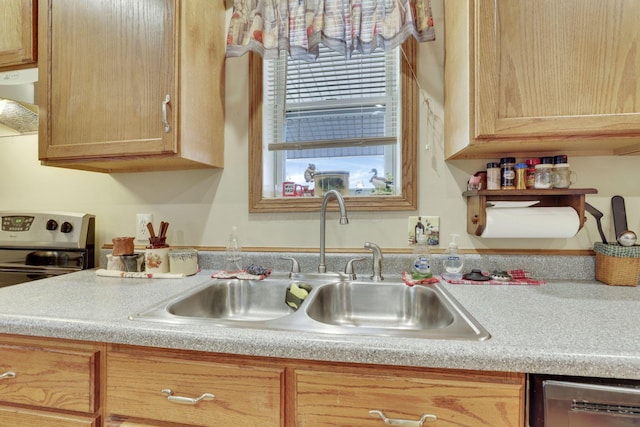 kitchen featuring dishwasher, extractor fan, light countertops, light brown cabinetry, and a sink