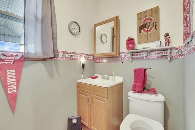 bathroom with toilet and vanity