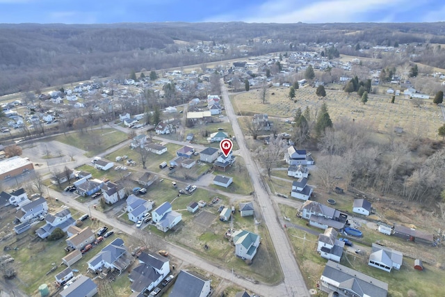 birds eye view of property with a residential view