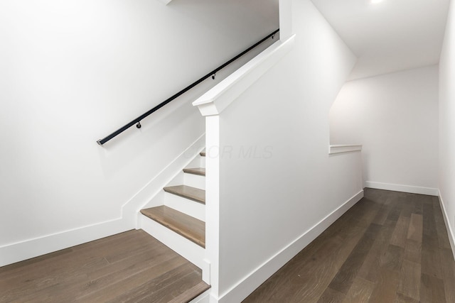 stairway featuring hardwood / wood-style flooring