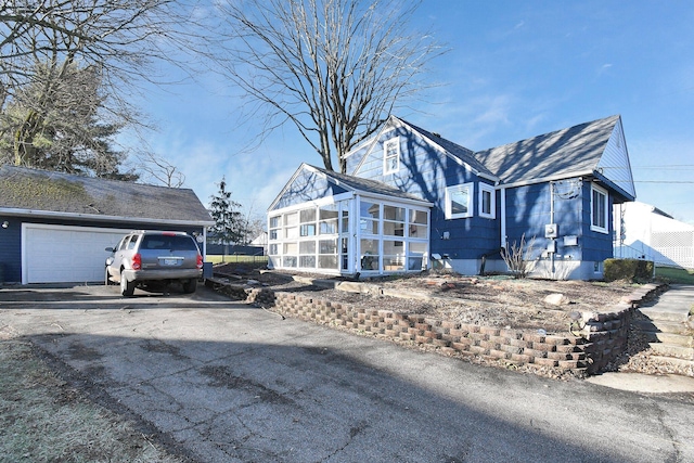 view of front facade with a sunroom