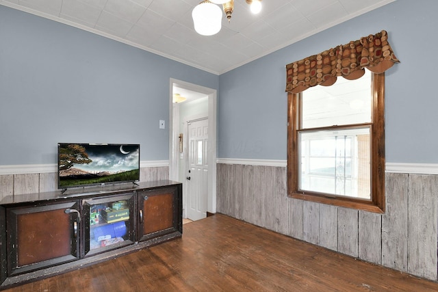 interior space with crown molding and dark wood-type flooring