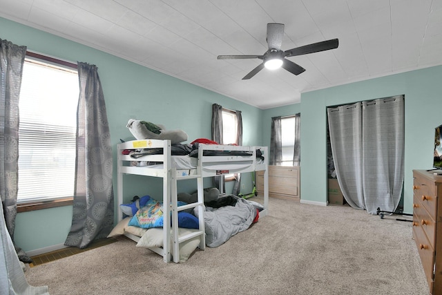 bedroom with ceiling fan and carpet