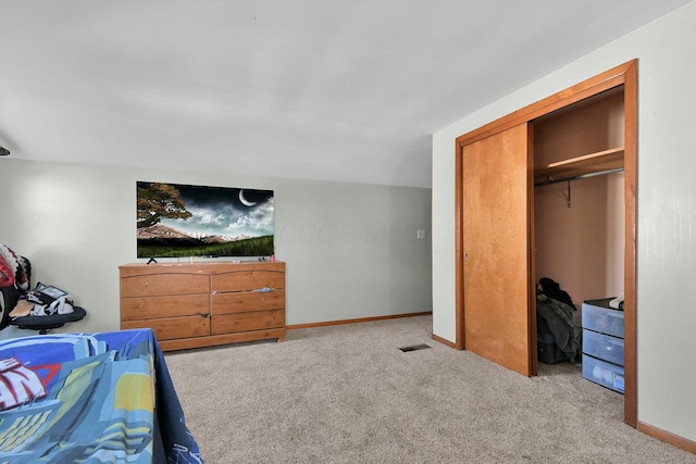 carpeted bedroom with a closet