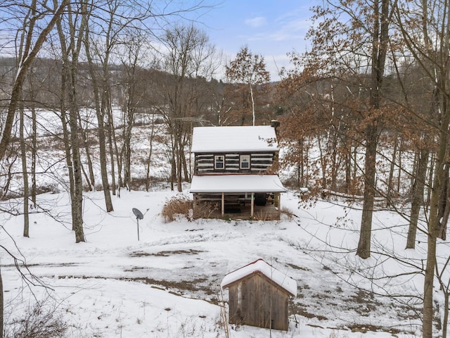 view of snow covered house