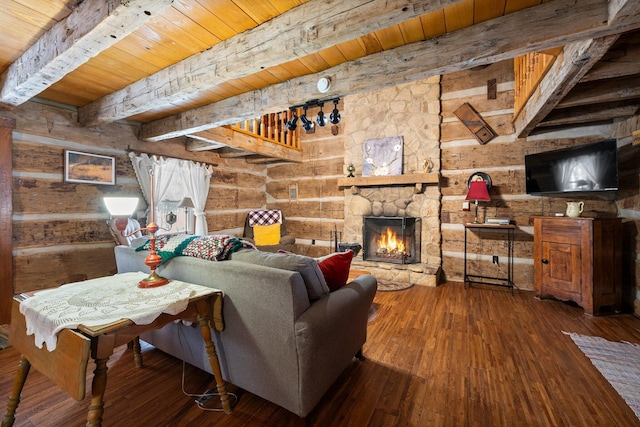 living room with wooden ceiling, log walls, a fireplace, wood-type flooring, and beam ceiling