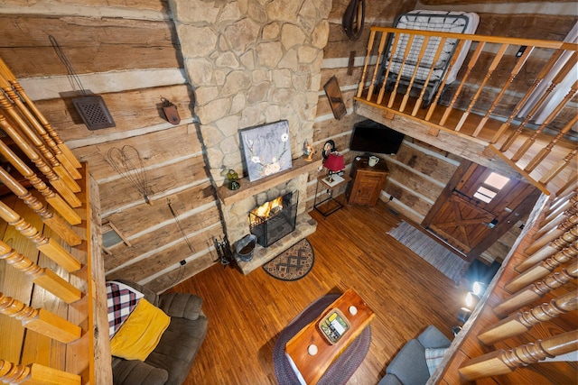 unfurnished living room with a stone fireplace