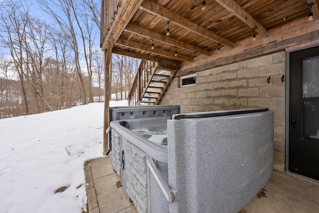 exterior details with a hot tub