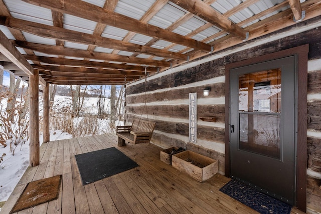 view of snow covered deck