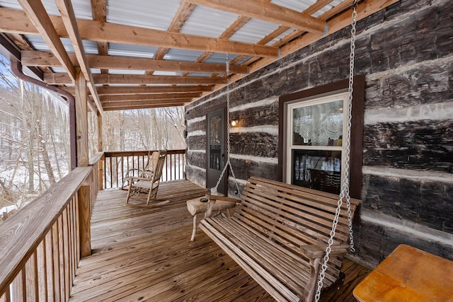 view of snow covered deck