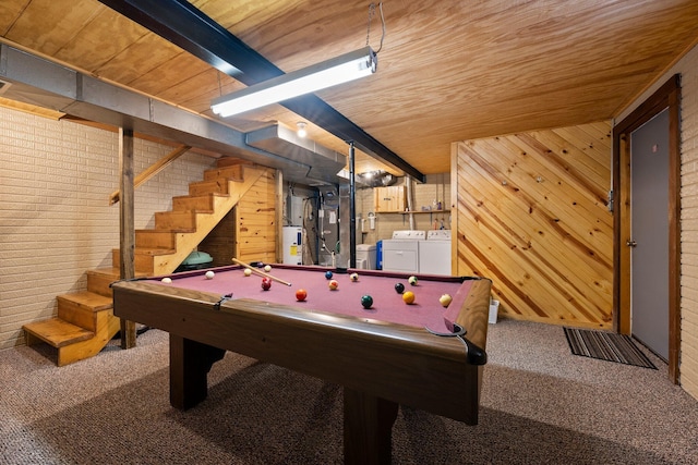 recreation room with wooden walls, wooden ceiling, carpet floors, separate washer and dryer, and beam ceiling