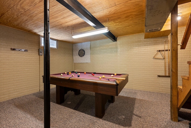 recreation room with brick wall, wood ceiling, and carpet floors