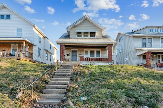 view of front of property featuring covered porch